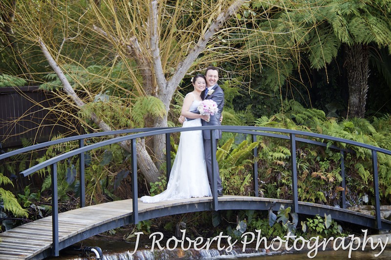 Bride and groom over a bridge - wedding photography sydney